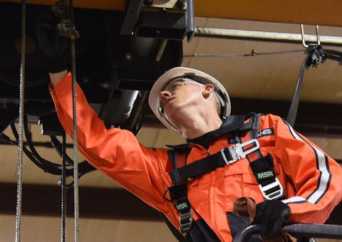 Konecranes technician inspects and repairs hoist
