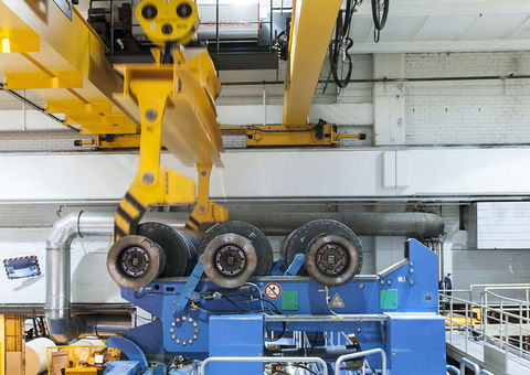 Roll handling crane in paper mill