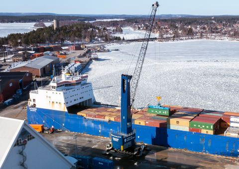 The all-electric Konecranes Gottwald Mobile Harbor Crane with battery drive handles containers in the Port of Skellefteå to support the new battery plant.