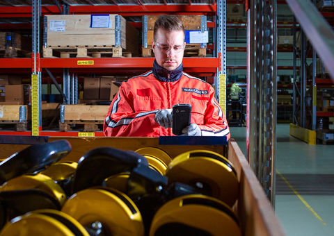 Worker in parts warehouse