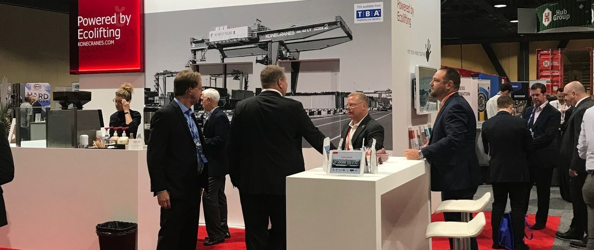 People at Konecranes stand at an expo